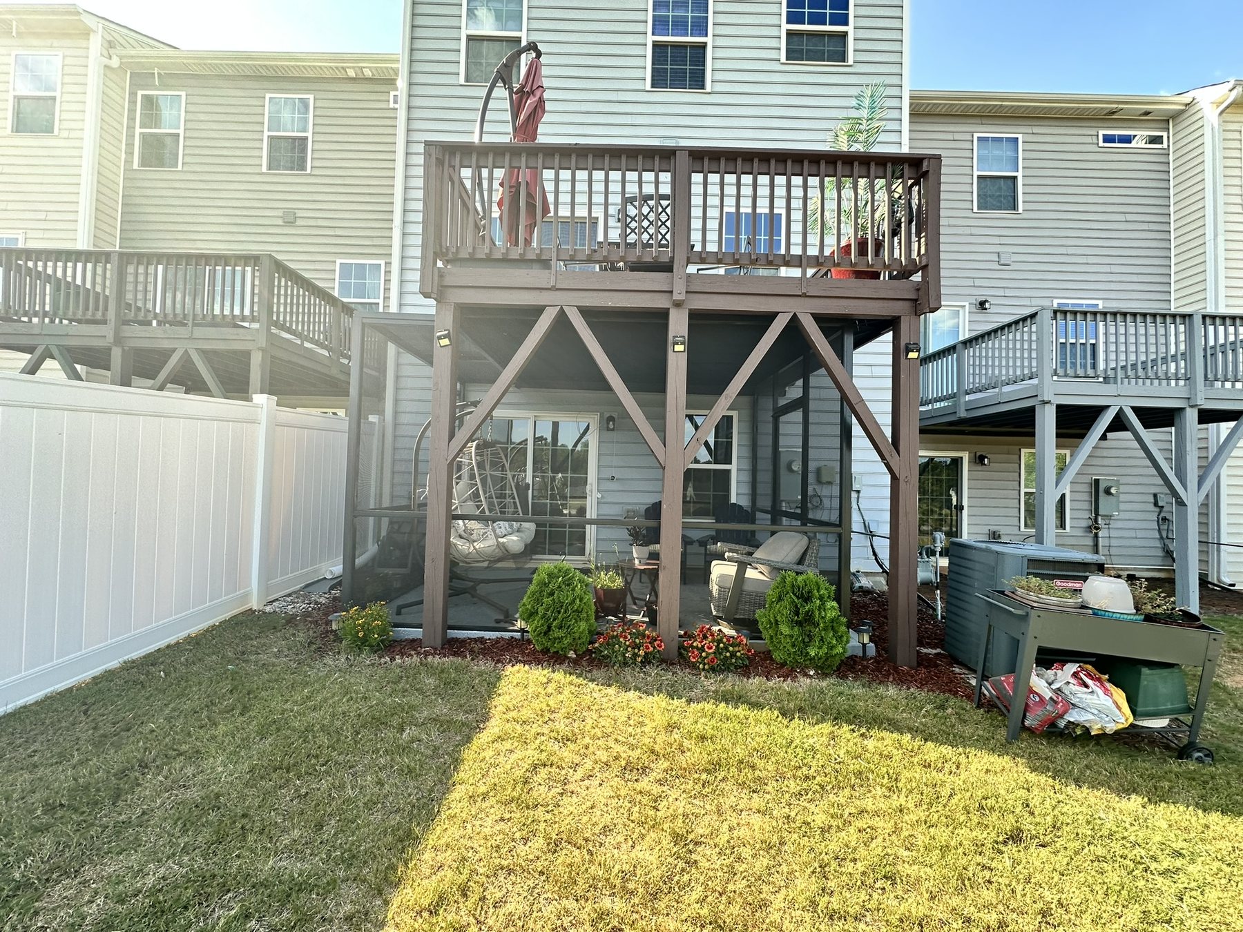Completed screen-roof enclosure beneath an elevated deck in Garner, North Carolina.