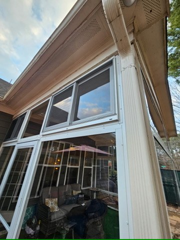Close exterior view of upper CWS acrylic horizontal sliders in white aluminum frames.