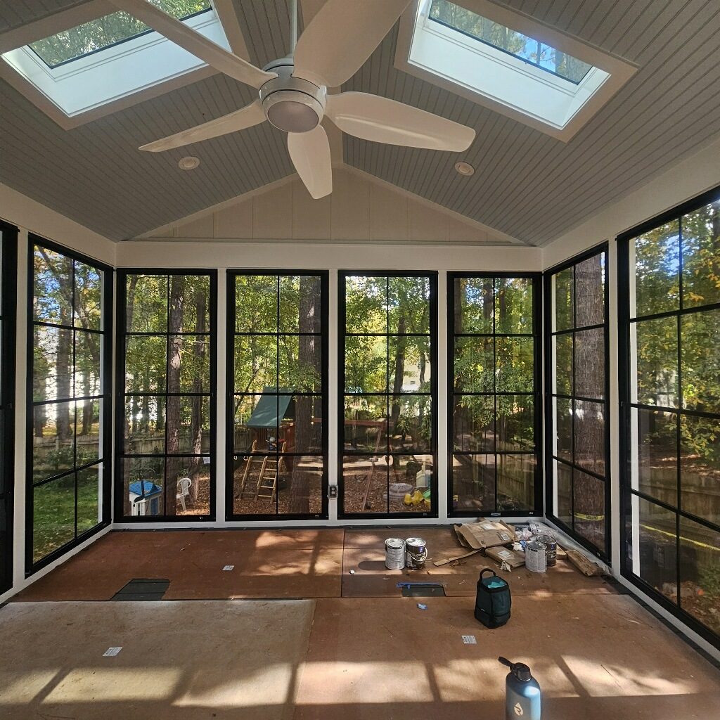 Black Eze-Breeze 4V60 vertical sliders installed from floor to top.