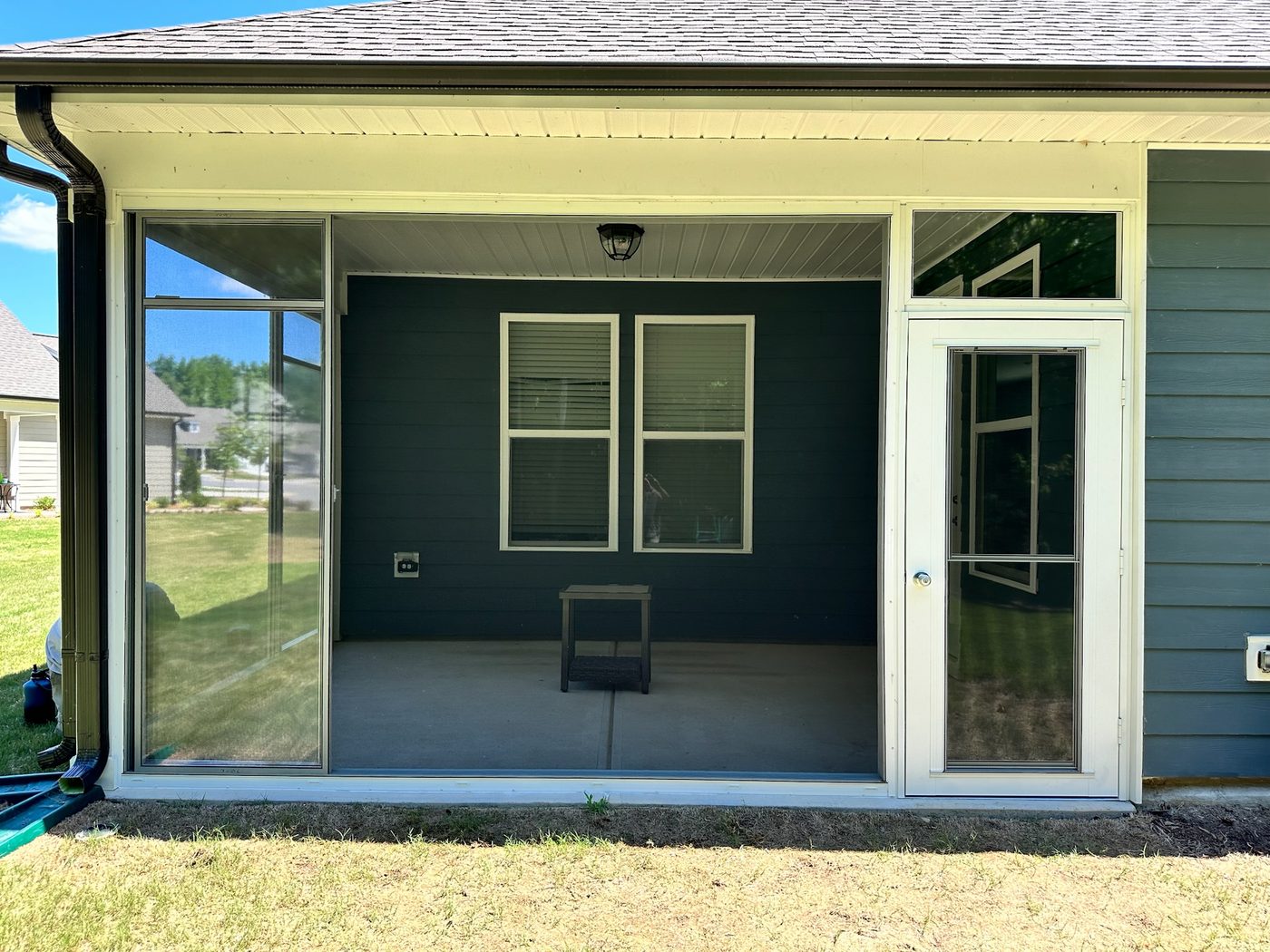 White Eze-Breeze CD90 Cabana door installed with surrounding enclosure panels.