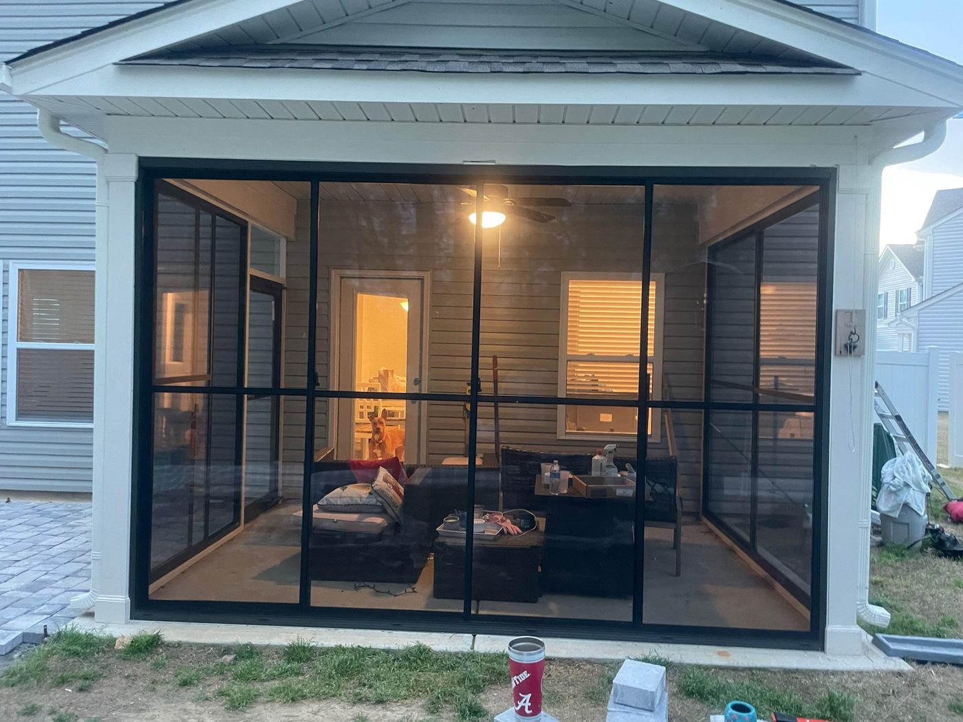 Black Eze-Breeze SS10 horizontal sliders in a full-height porch enclosure.