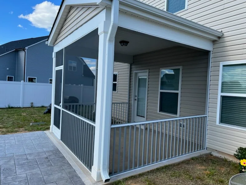 White extruded-aluminum screened enclosure with Zeus door, 36-inch picket rail, and standard mesh.