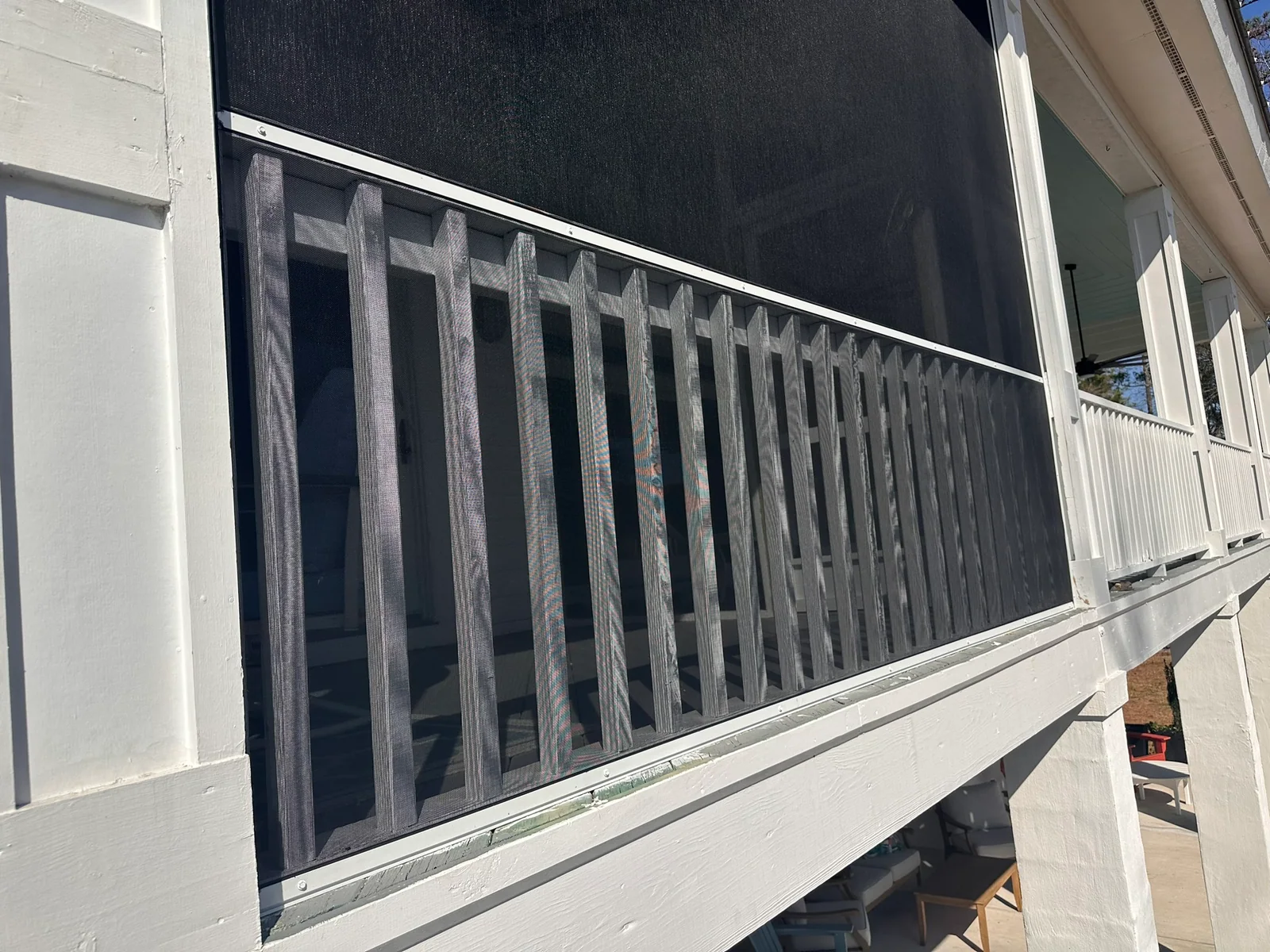 Close view of white EZ Screen framing and No-See-Ums TuffScreen at the lower porch section.