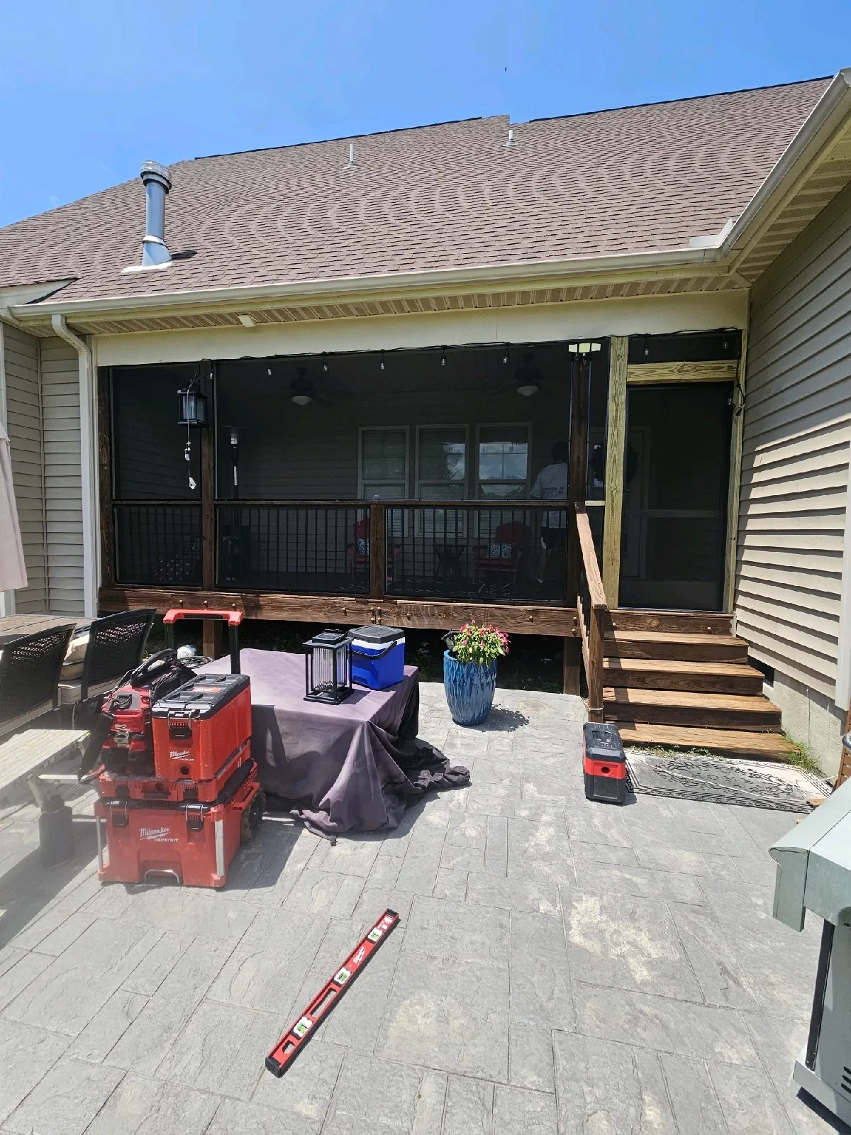 Standard charcoal porch screen installed in black removable aluminum panels on a Raleigh porch.