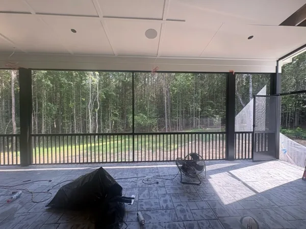 UltraVue2 screen mesh installed in black extruded-aluminum framing with a picket rail and PCA A-100 door.