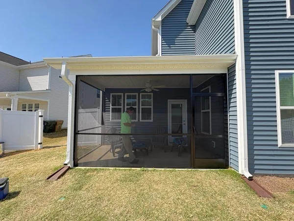 PetScreen installed in black extruded-aluminum framing with a 36-inch rail and PCA Zeus door.