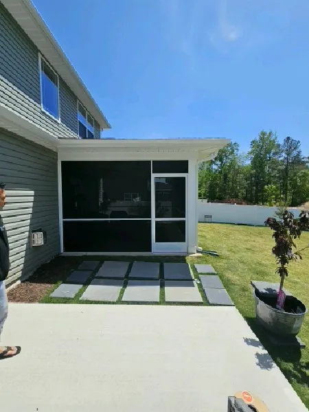 SunTex 80 installed in white extruded-aluminum framing with a rail and PCA Zeus door.