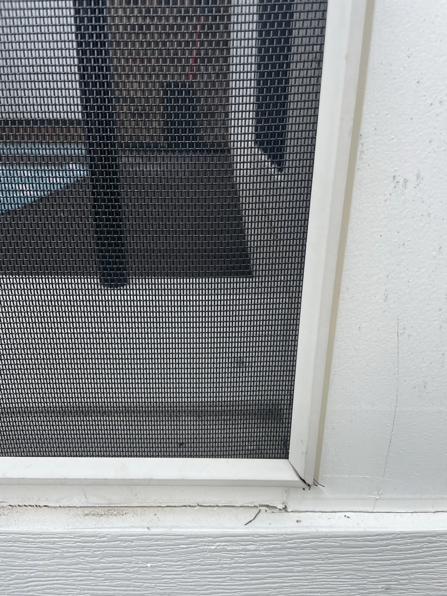 Close-up of screen secured by an installed white SCREENEZE cap.