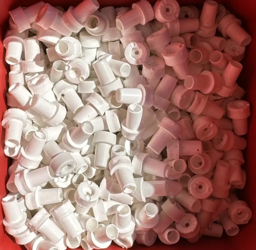 White caps used as pull handles on window-screen retention pins.