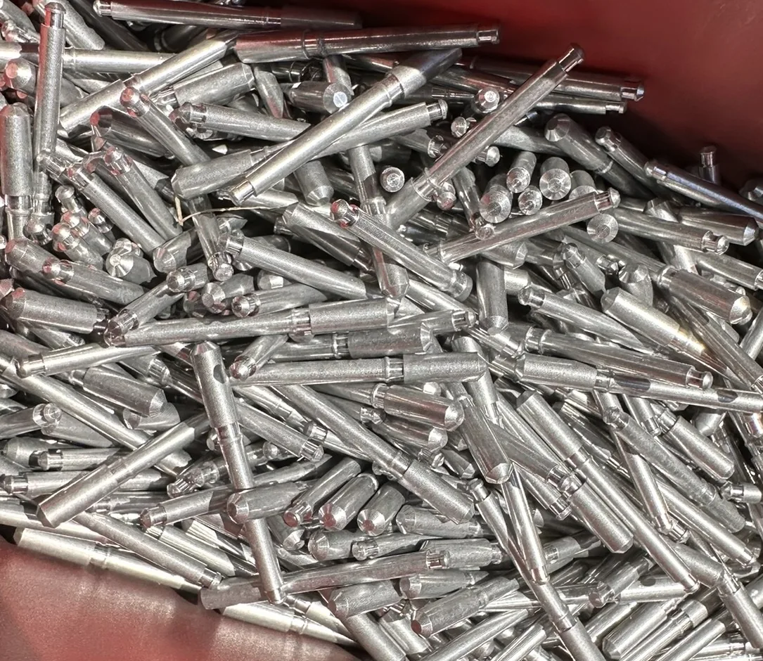 Metal pull pins used in some window-screen retention assemblies.