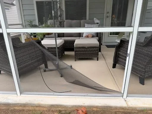 Porch screen mesh hanging loose after spline pulled out of the lower channel.