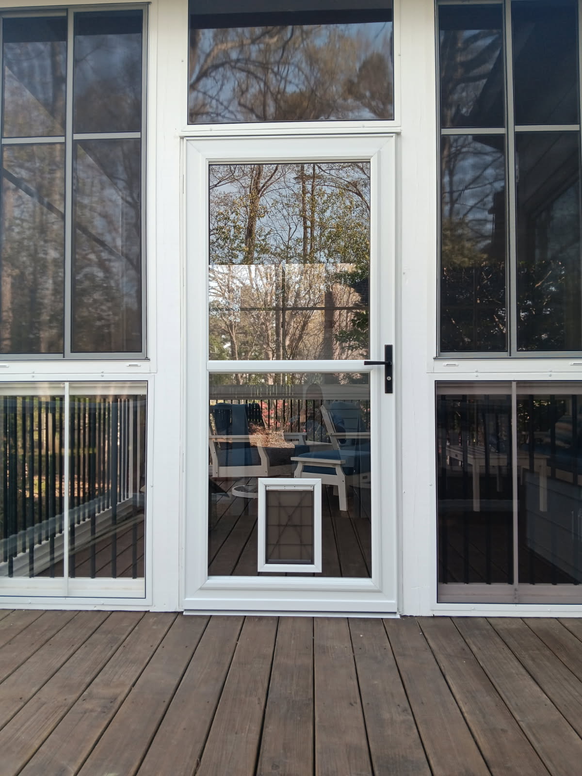 White Larson 80 Pet Split Fullview storm door with an integrated pet door and brushed-nickel handle.