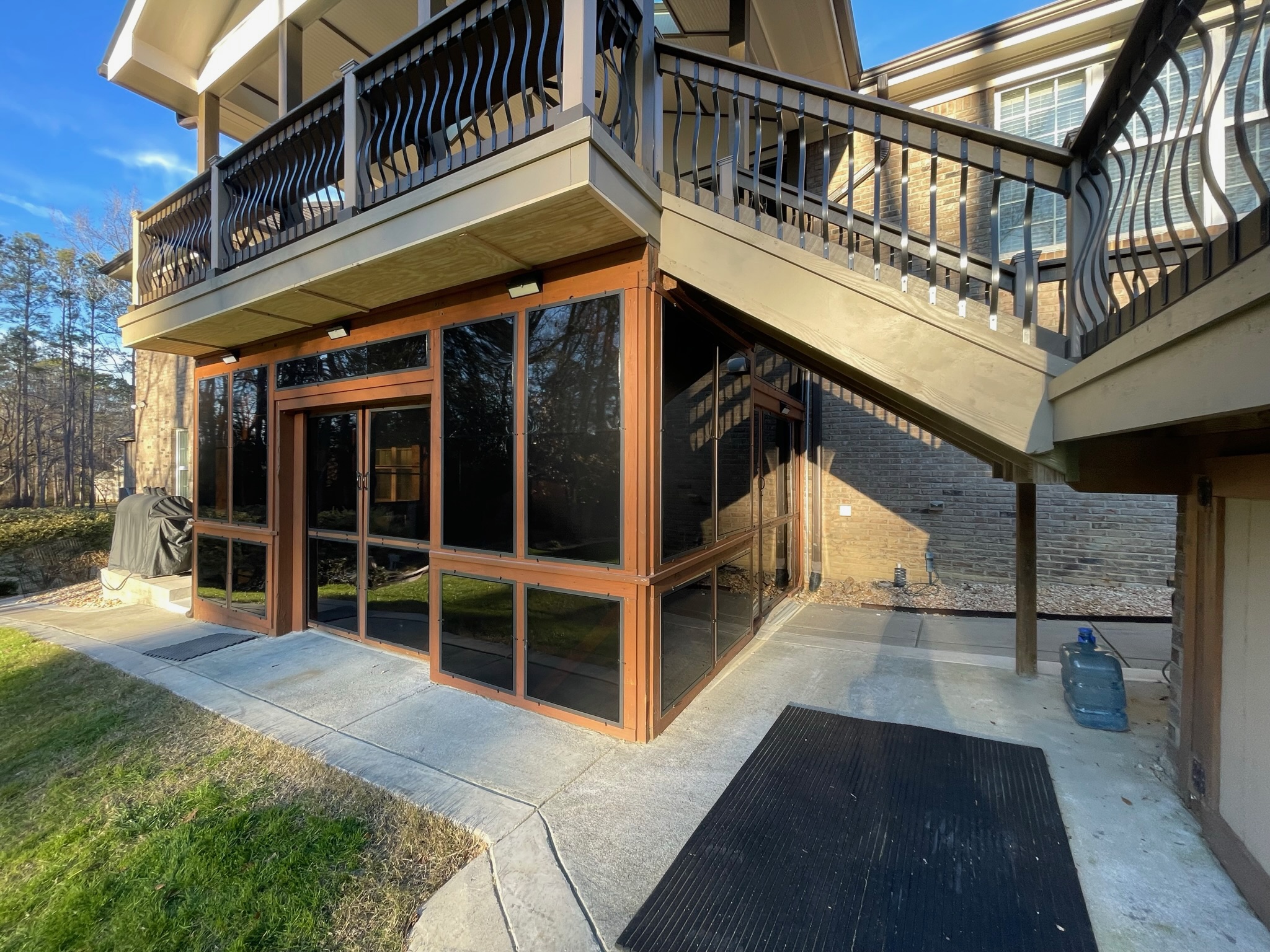Eze-Breeze LF20 fixed transom panels installed above porch openings.