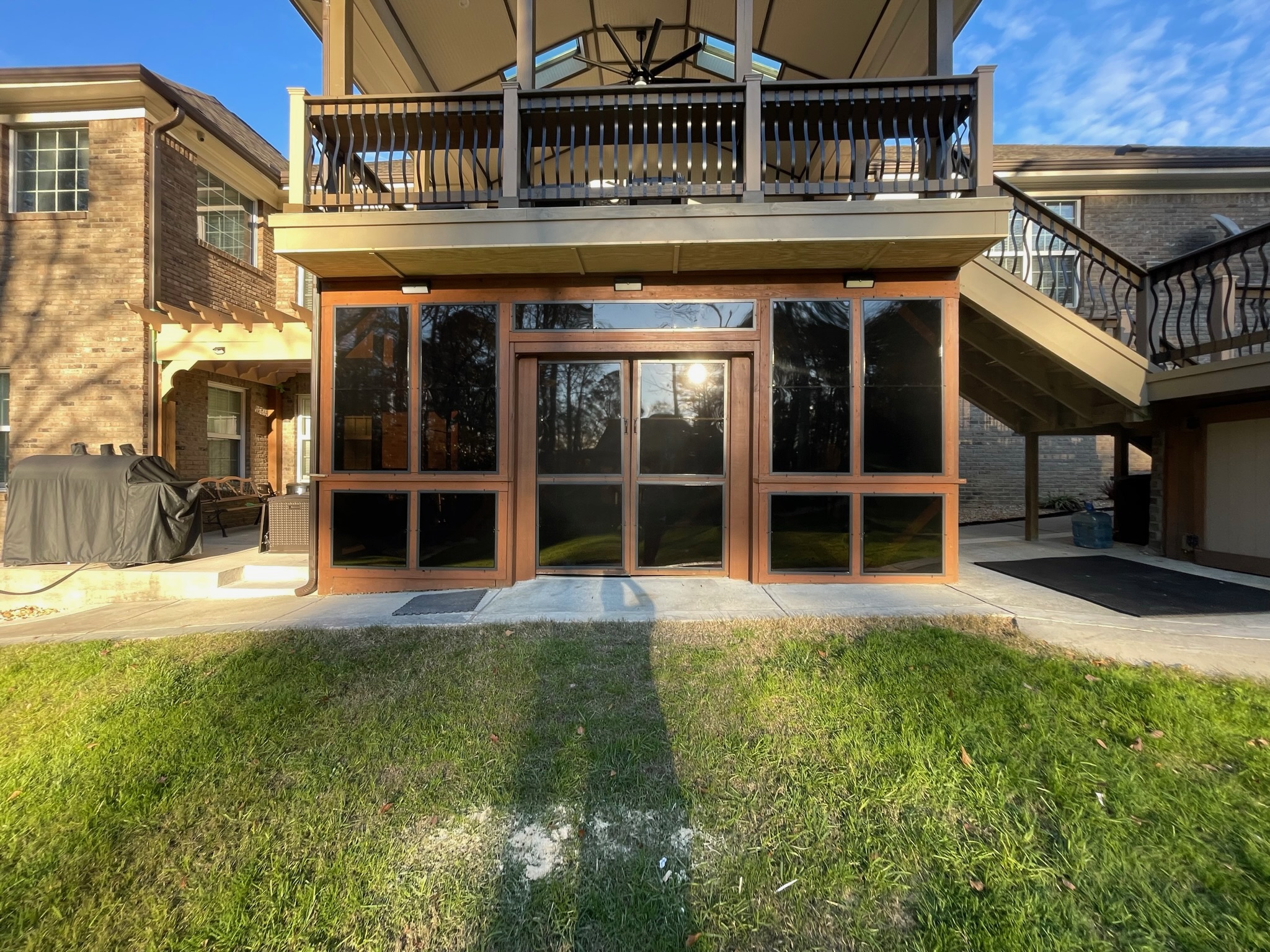 Eze-Breeze LF20 fixed panels enclosing the area below an existing porch rail.