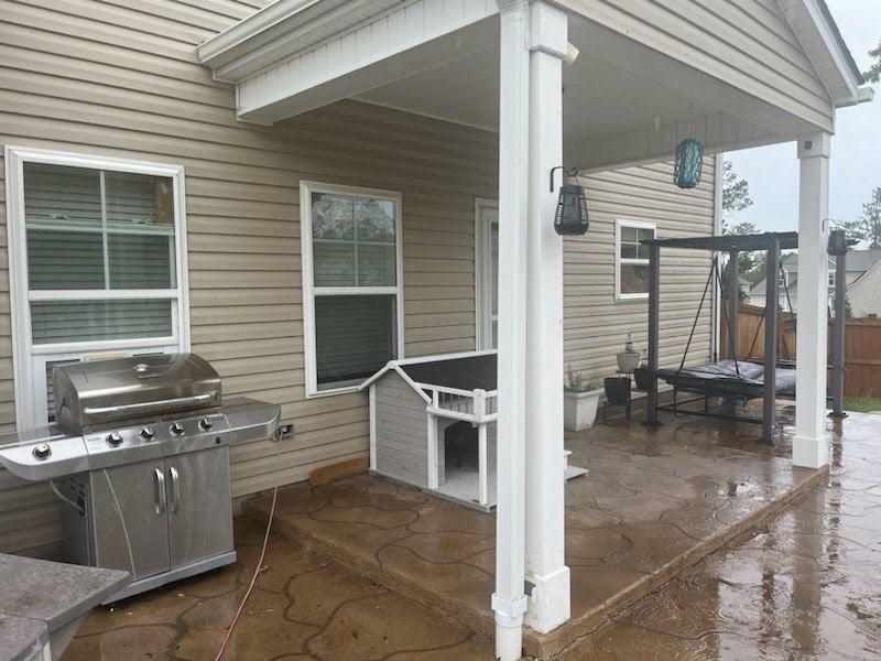Covered patio photographed before a screen-enclosure project