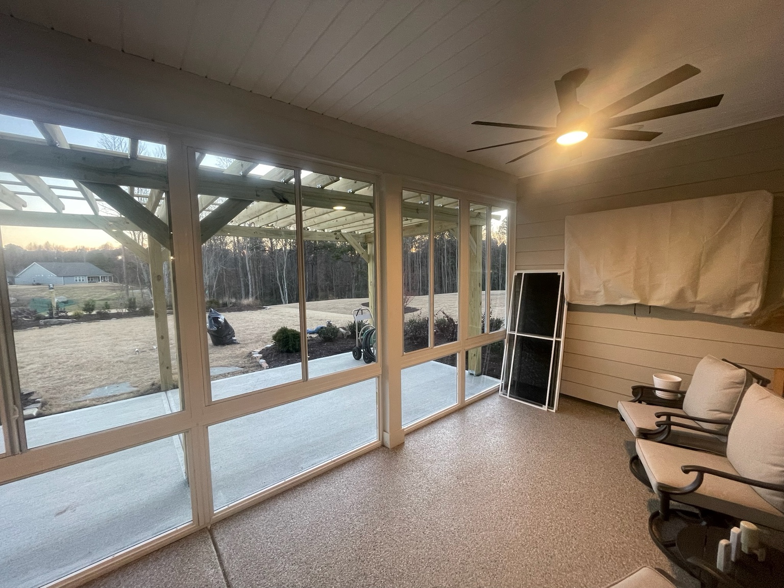 Interior view through white-framed CWS glass porch windows.