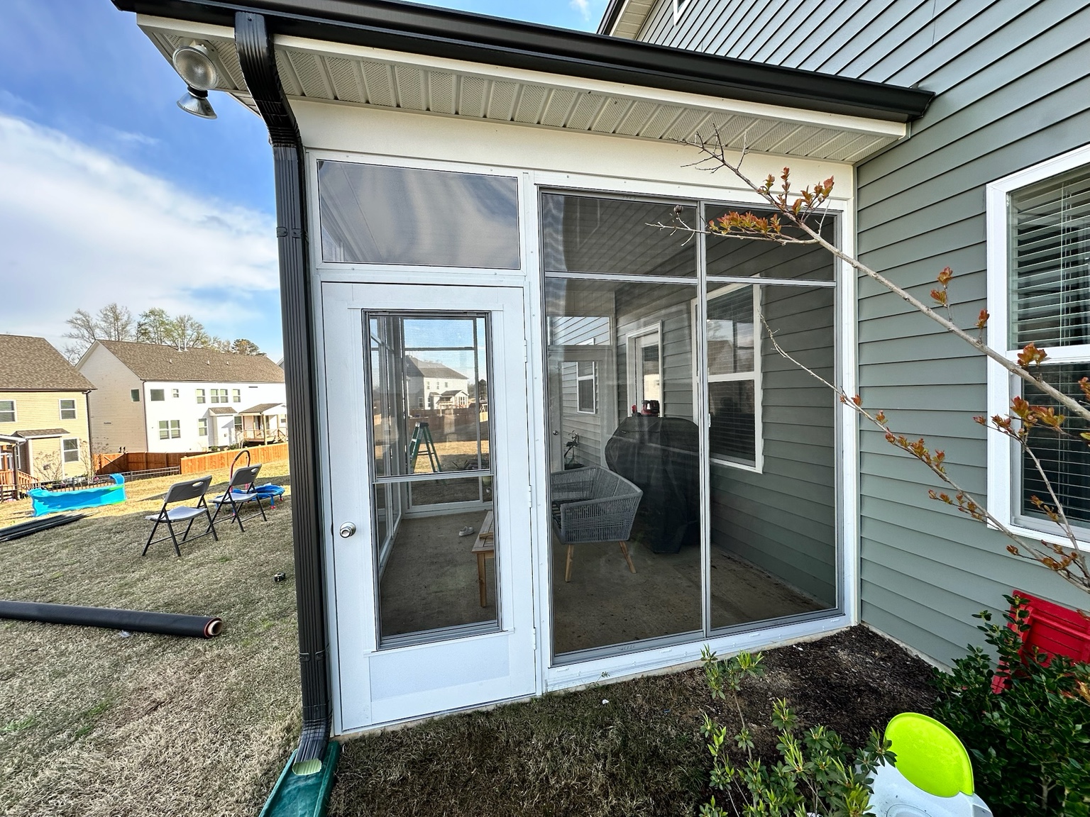 Eze-Breeze CD90 Cabana door installed as part of a porch enclosure.