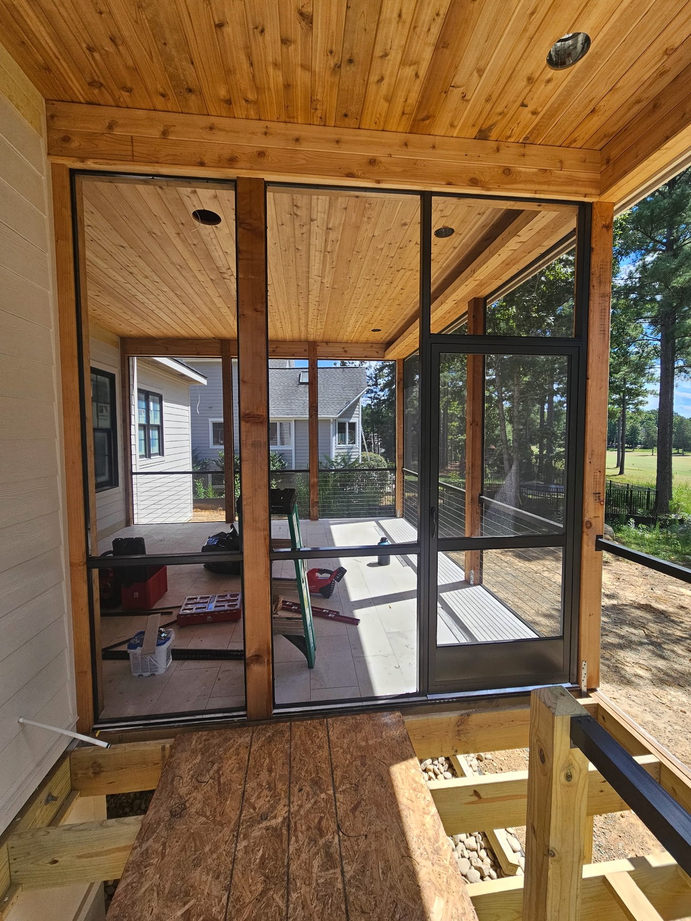 Bronze ARC and extruded-aluminum screen enclosure with a bronze PCA Zeus door in Pittsboro, North Carolina.