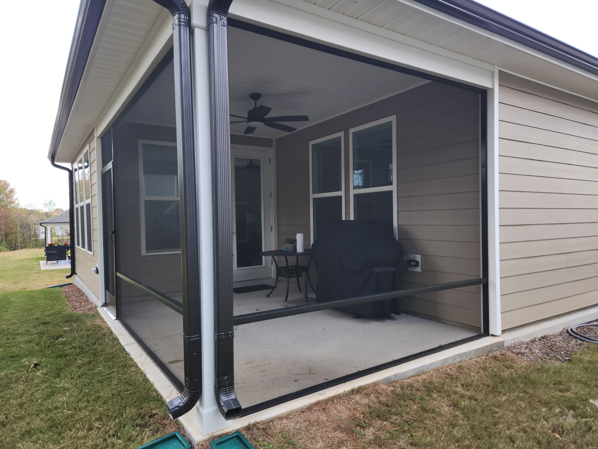 Bronze extruded-aluminum screen porch with a rail at 24 inches.