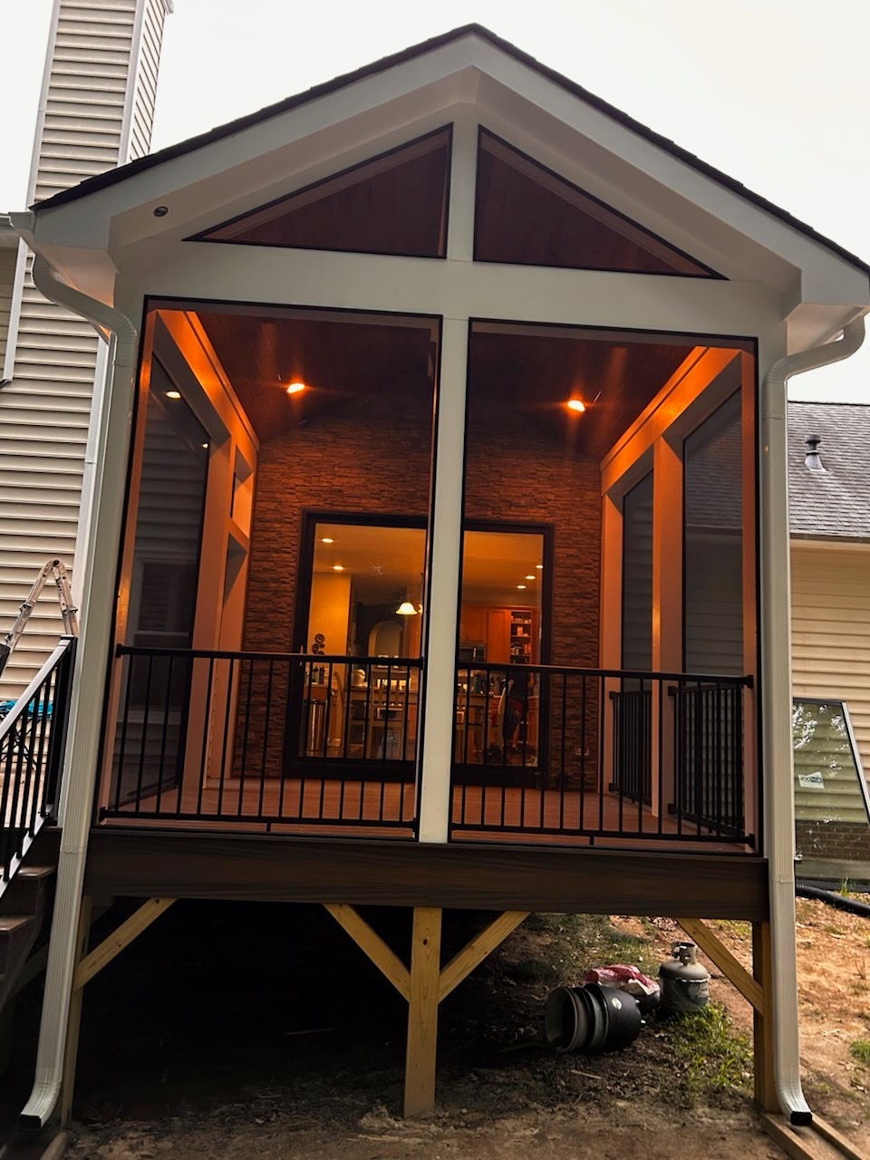 ScreenEZE installed in a porch gable and triangular openings.